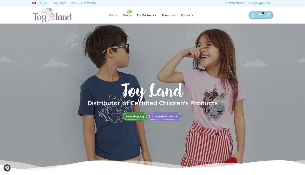ToyLand homepage with two children, the main navigation and calls to start shopping or start a B2B partnership.